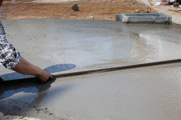 laborers made new construction of street and floor by cement concrete