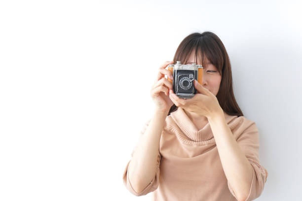 Young woman holding camera