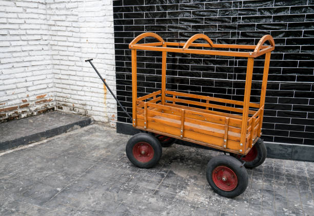 An abandoned cart at the side of the road.
