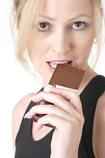 istock woman cheating on her diet 89958174