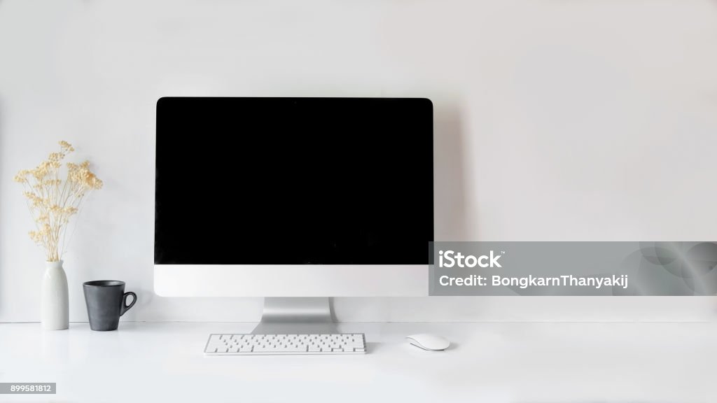 Modern clean workspace mockup with blank screen desktop computer. Computer Stock Photo