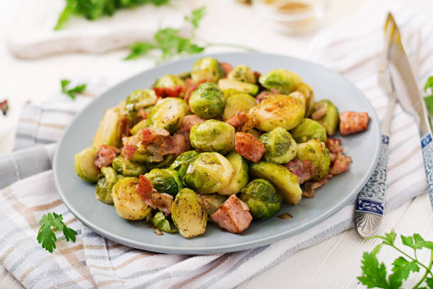 istock Brussels sprouts. Roasted Brussels sprouts with bacon. Delicious lunch. 899593500