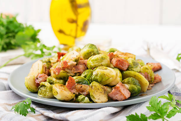 istock Brussels sprouts. Roasted Brussels sprouts with bacon. Delicious lunch. 899593502