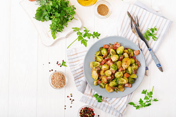 istock Brussels sprouts. Roasted Brussels sprouts with bacon. Delicious lunch. Flat lay. Top view 899593504
