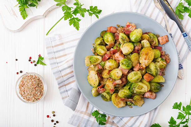 Brussels sprouts. Roasted Brussels sprouts with bacon. Delicious lunch. Flat lay. Top view