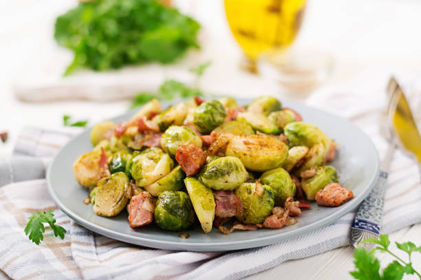 istock Brussels sprouts. Roasted Brussels sprouts with bacon. Delicious lunch. 899593508