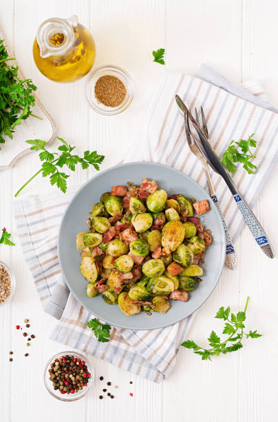 istock Brussels sprouts. Roasted Brussels sprouts with bacon. Delicious lunch. Flat lay. Top view 899593514