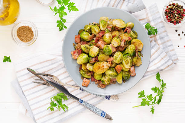 istock Brussels sprouts. Roasted Brussels sprouts with bacon. Delicious lunch. Flat lay. Top view 899593520