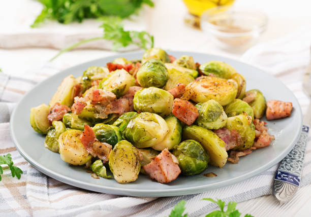 istock Brussels sprouts. Roasted Brussels sprouts with bacon. Delicious lunch. 899593538