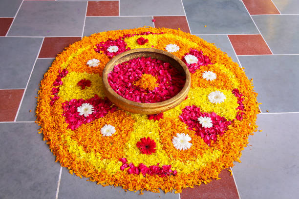 Yellow Flower Rangoli A yellow flower rangoli is made. Its a Indian tradition to put a rangoli at entrance on any auspicious occasions flower rangoli stock pictures, royalty-free photos & images