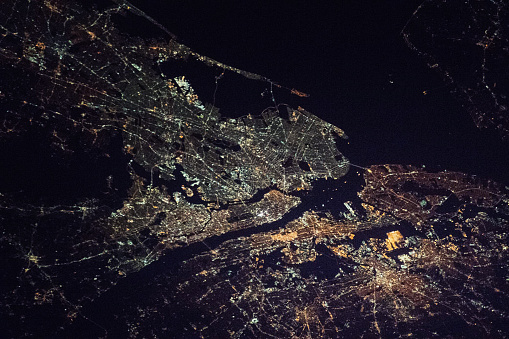 New York City - the Bronx, Manhattan, Queens, Brooklyn and Staten Island, and part of the state of New Jersey night space view (elements of image furnished by NASA)