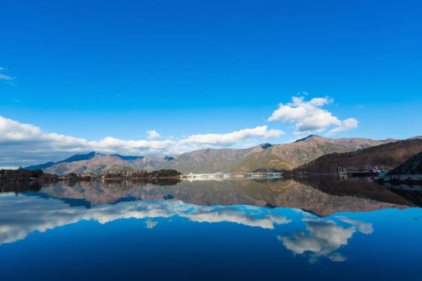 istock landscape river reflection view of bridge, mountain and traffic under blue sky, nature background 899597900