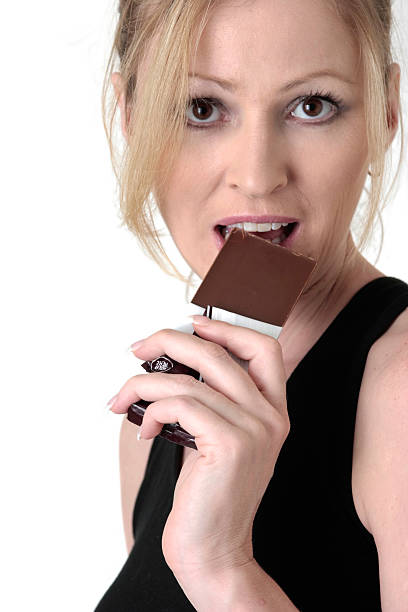 istock woman cheating on her diet 89960468