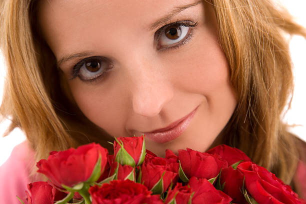 Portrait of a girl with a red gerbera flower