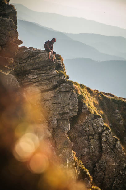 istock Hiker Sitting Alone At The Mountain 899611304