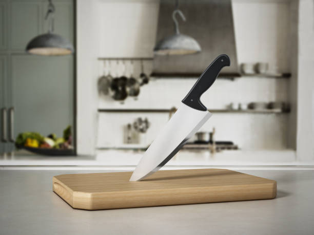 istock Kitchen knife on cutting wood standing on kitchen counter 899614072