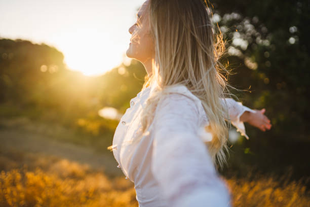 istock Sensing the breeze and soft light of sunset. 899624586