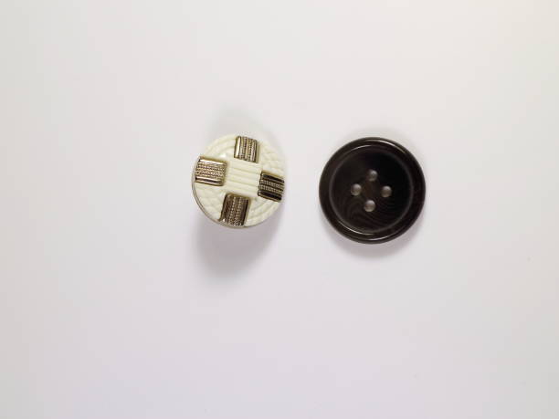 istock white and black button for clothes on white background 899628460