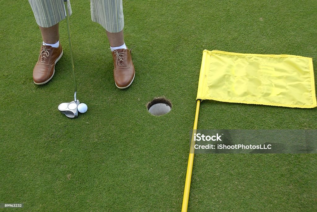 Golf Putting Green, Putter und Flagge - Lizenzfrei Einlochen - Golf Stock-Foto