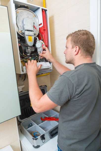 istock Technician repairing Gas Furnace 899632430