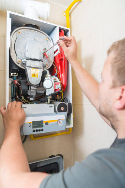 istock Technician repairing Gas Furnace 899632434