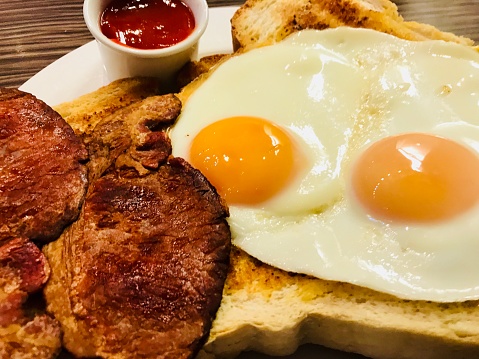 Two fried eggs on toast