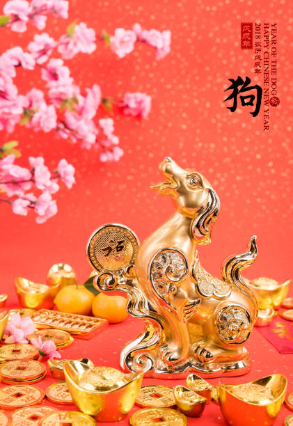 istock golden dog statue on red paper 899633114