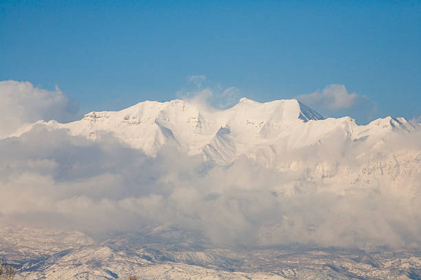 This is the springtime view of Mt. Timpanogos still covered in snow.  In the foreground are the blossoms from a tree which blooms starting in May.  Still haven't figured out what kind of tree this is.  I took this shot one evening at three different time intervals looking for this best light and decided this was the one to keep.
