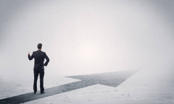 istock Standing salesman looking ahead with arrow 899635136