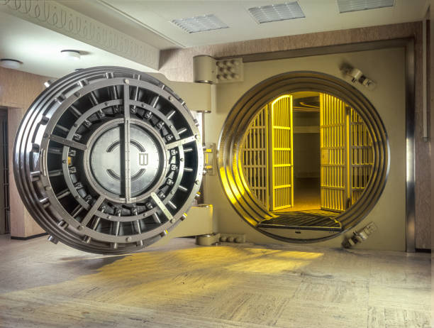 Very large Open Safe With golden  Light shining from within the safe. Very large Open Safe With golden  Light shining from within the safe. netherlands currency stock pictures, royalty-free photos & images
