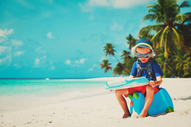 istock little boy travel on summer tropical beach 899639496