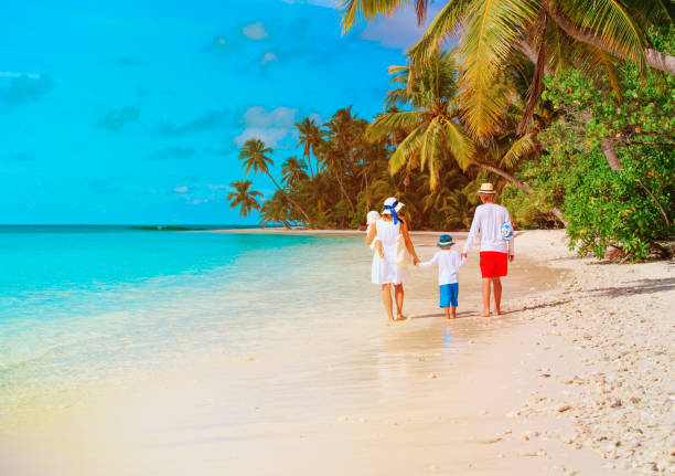 istock family with two kids walk on beach 899639952