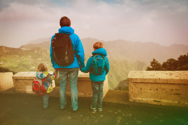 istock father with two kids travel in mountains 899640252