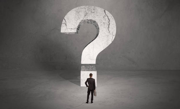 istock Confused businessman and big question mark 899640368