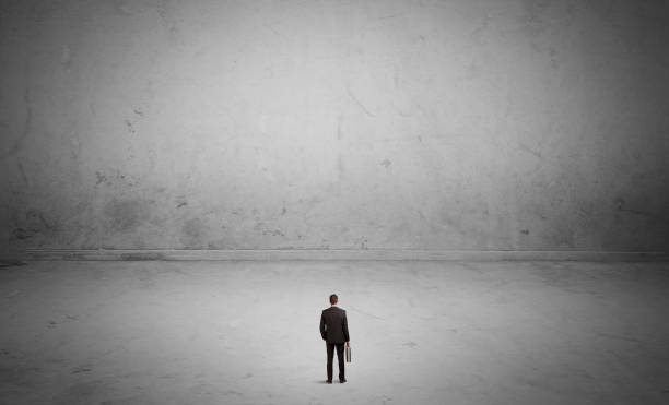 istock Small business person in large empty space 899640470