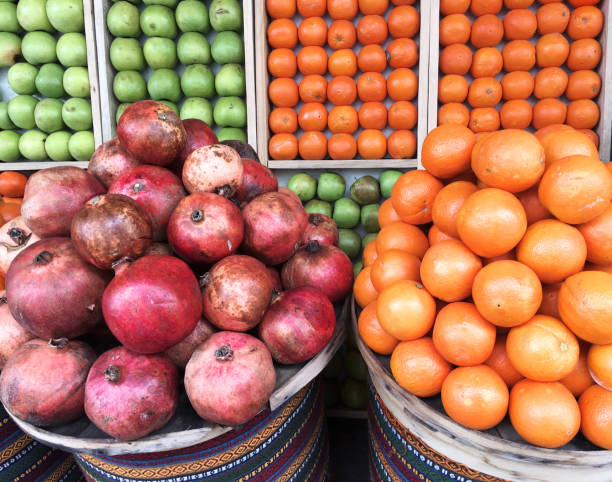 Fresh Oranges with Green Apples in boxes
