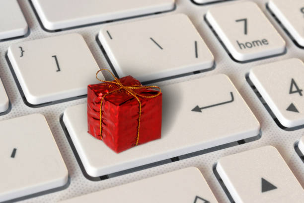 istock on the button Enter, the gift box on the keyboard 899649296