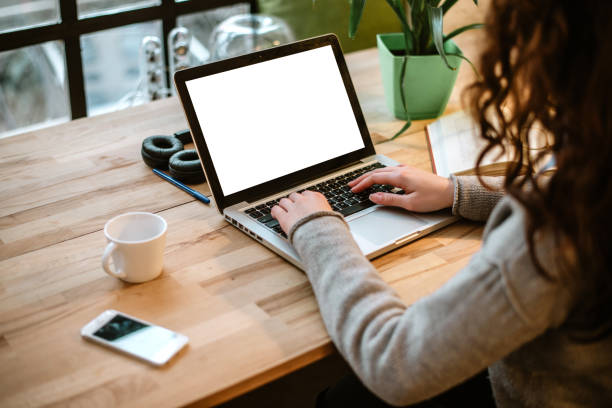 istock Rear view of student girl using laptop 899652298