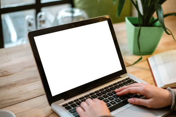 istock Cropped view of young office worker sitting at table and typing on laptop. 899652314