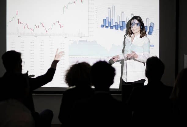 istock Business conference with projection screen audience asking question 899658386