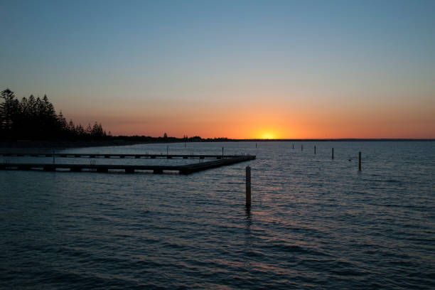 istock Sunset over Geographe Bay with ocean bathes in foreground 899666020