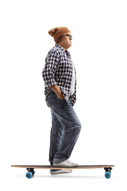 istock Old hipster with a longboard waiting in line 899666856