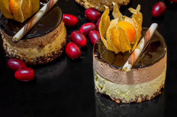 istock French cakes. On a black glossy background with real reflection. Selective focus. Top view 899670094