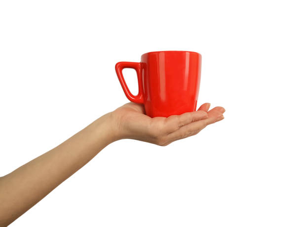 istock female hand with a red cup isolated 899670944