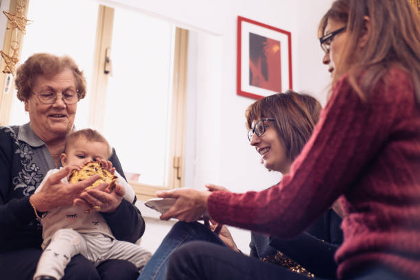 istock Four Generation Women Celebrating Christmas Together 899671170