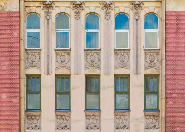 istock Windows in row on facade of historic building 899682470