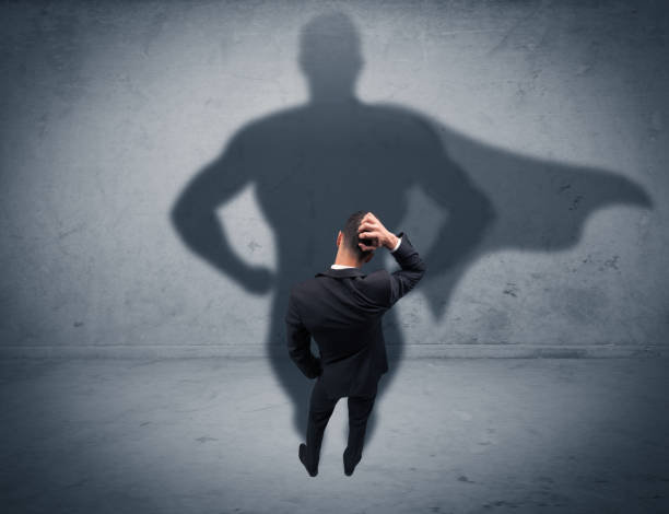 istock Successful businessman with superhero shadow 899683516