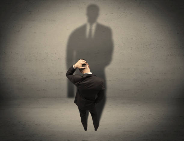istock Businessman looking at big shadow concept 899683538