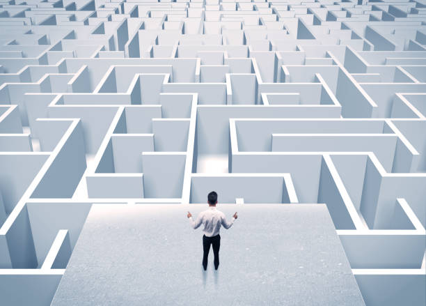istock Businessman staring at infinite maze 899683954