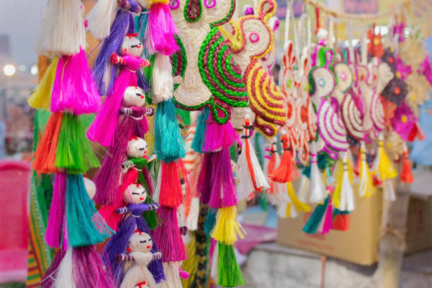 istock Colored jute dolls - handicrafts on display for sale 899691522